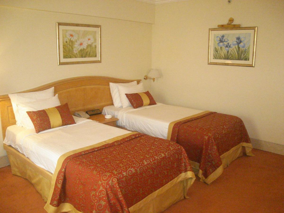 Ramada Plaza By Wyndham Palm Grove Hotell Mumbai Eksteriør bilde A room at the hotel