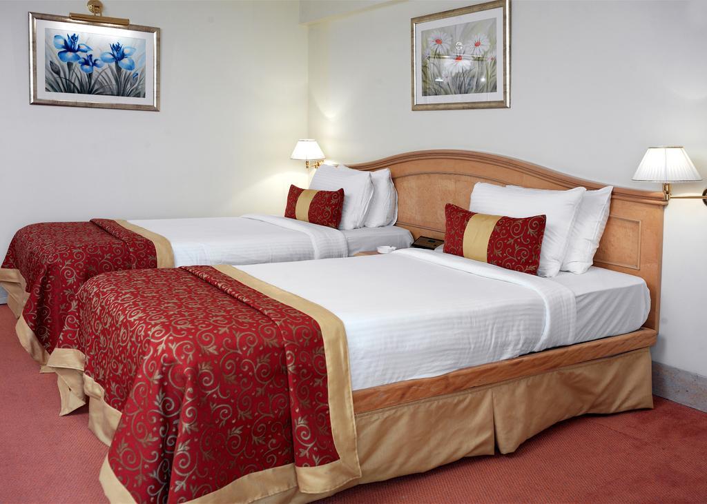 Ramada Plaza By Wyndham Palm Grove Hotell Mumbai Eksteriør bilde A guest room at the hotel